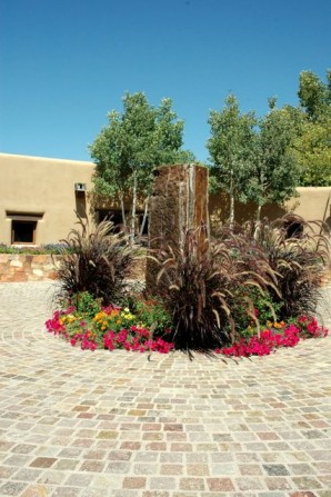 fountain, water feature, standing stone,fountain grass, annuals, pretty flowers,